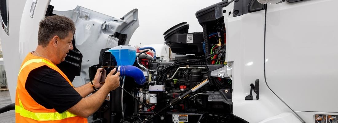 Trucker conducts vehicle inspection