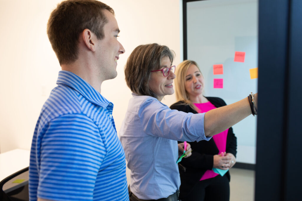Team in a training session discussing cybersecurity best practices.