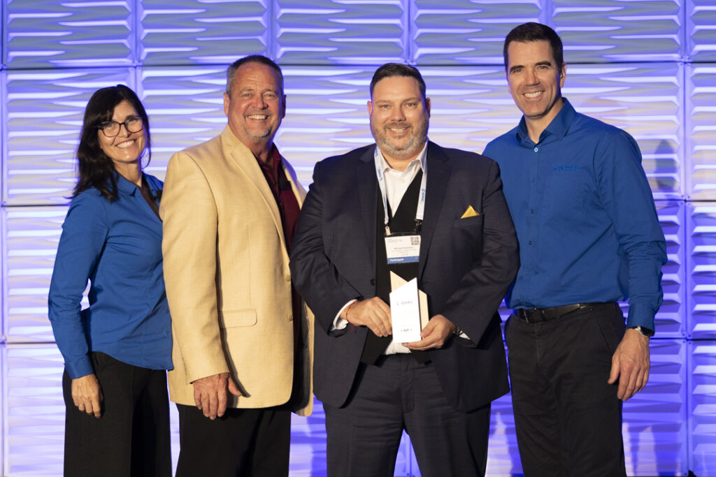 C.A.T. Inc. receiving the Driver Retention Award at ISAAC HORIZON 2024, with Michael Robinson and ISAAC CEO Jacques DeLarochelliere.