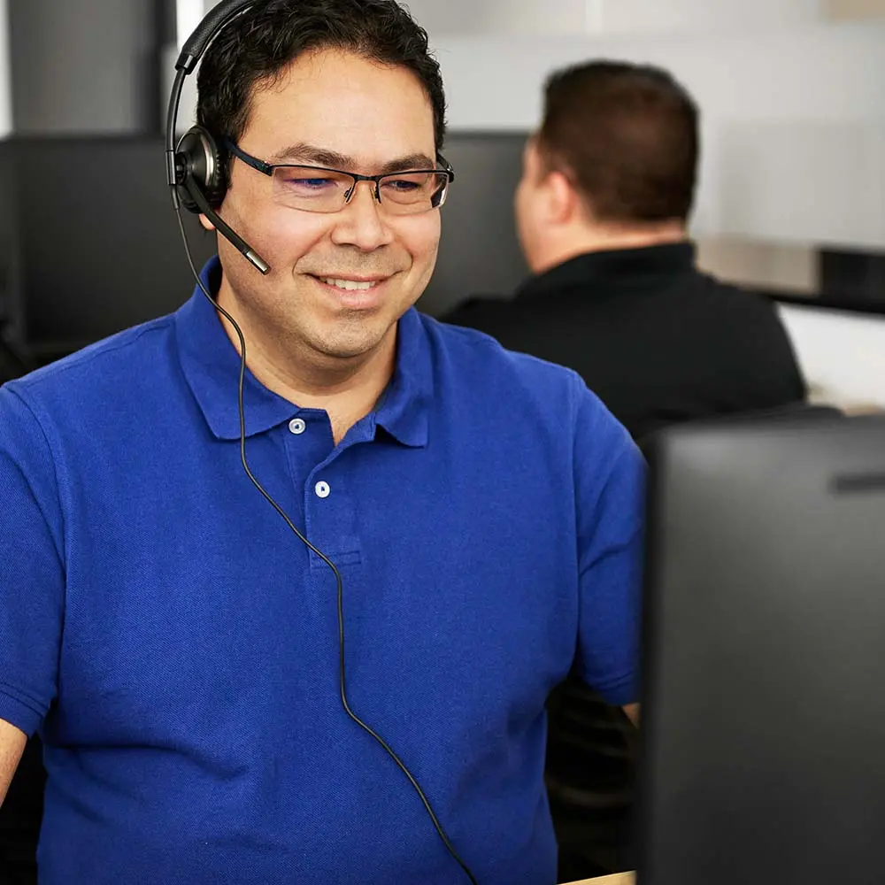 ISAAC support representative wearing headset providing remote assistance