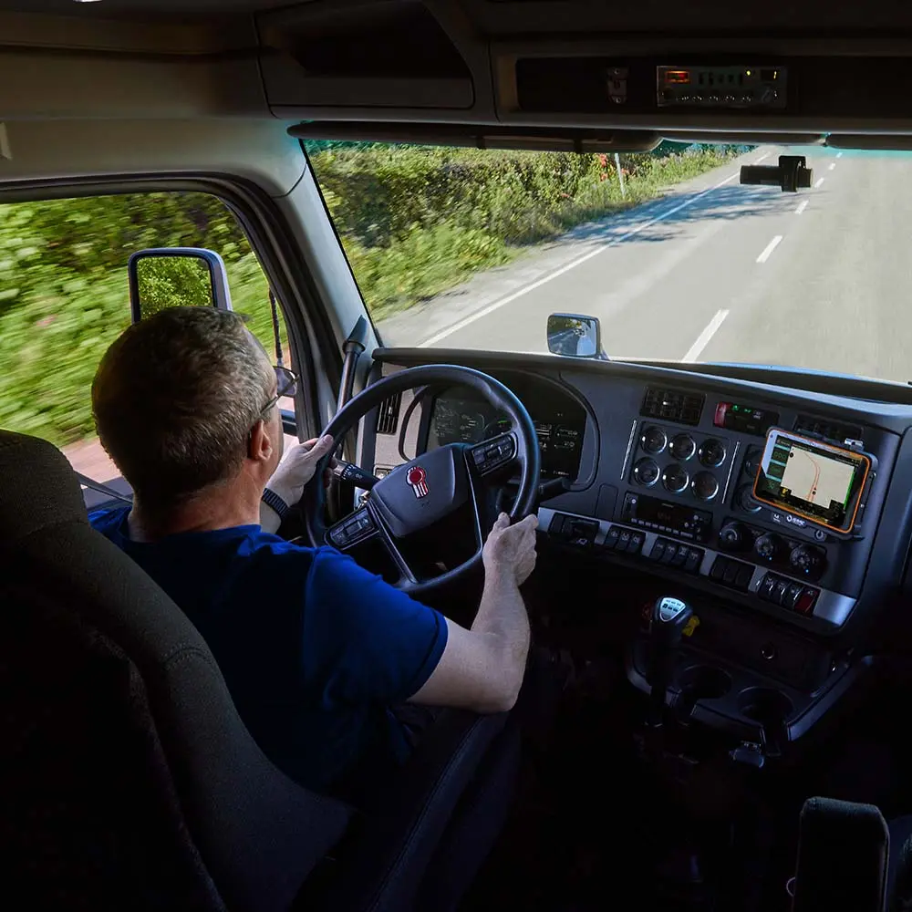 Truck Dashboard with ISAAC Display Truck driver using ISAAC tablet mounted on dashboard for performance tracking