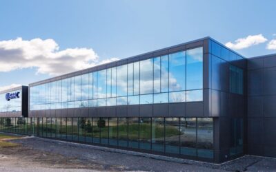 Modern glass exterior of ISAAC Instruments' expanded 52,000-square-foot headquarters in the Saint-Bruno-de-Montarville Ecopark, symbolizing the company's local innovation and AI leadership in the trucking industry.